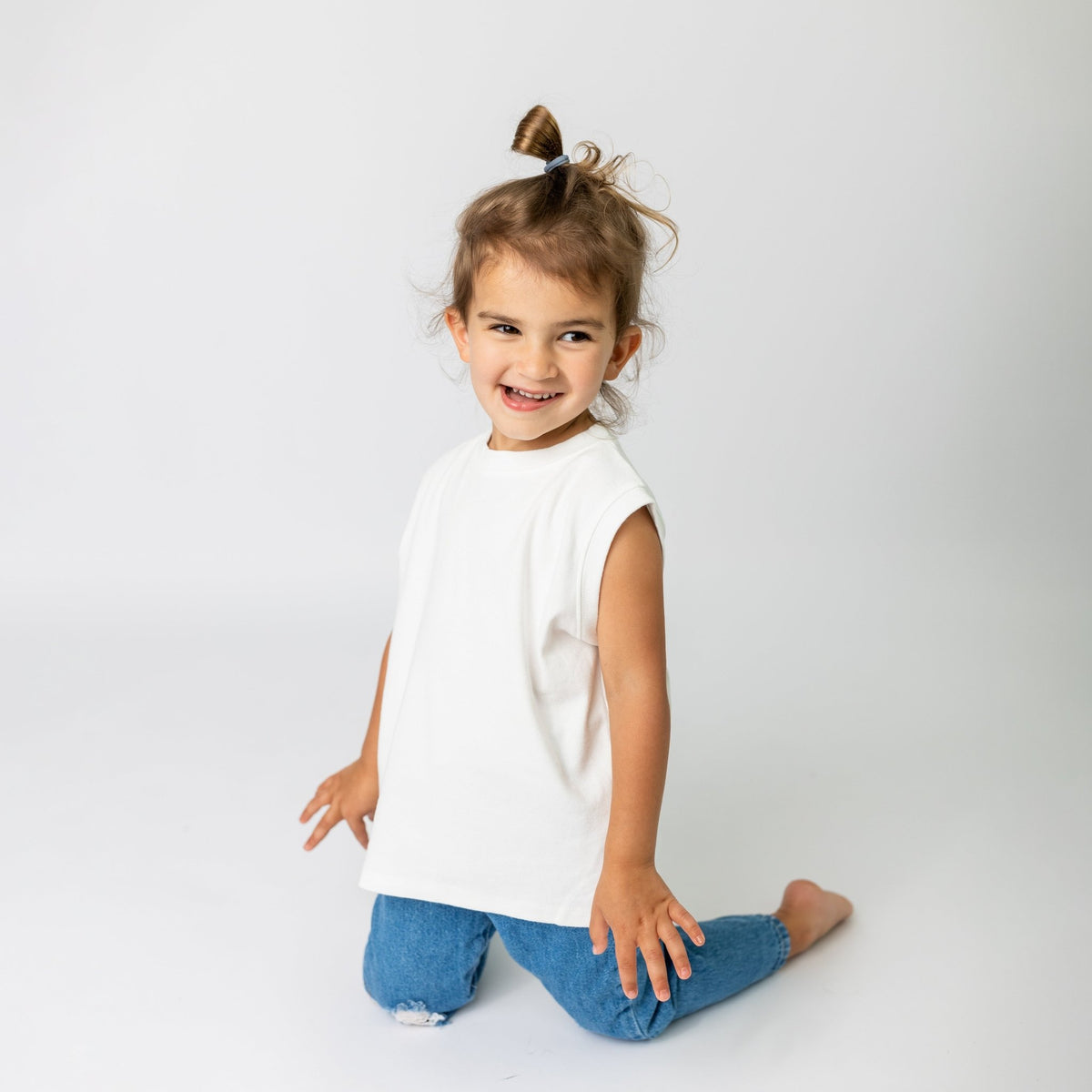 Toddler wearing the original super soft high quality cotton white sleeveless shift in relaxed oversized fit - comfortable quality children's clothing