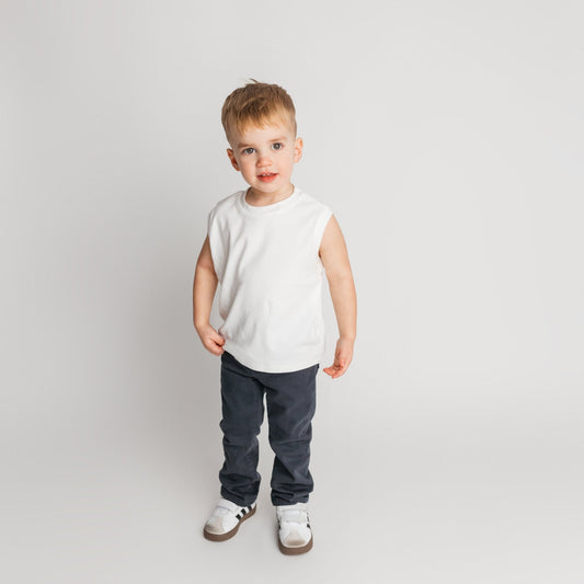 Toddler wearing the original super soft high quality cotton white sleeveless shirt in relaxed oversized fit - comfortable quality children's clothing