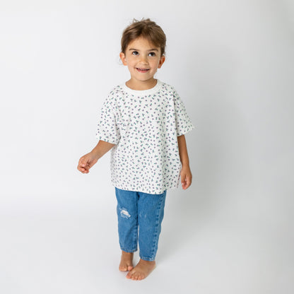 Toddler wearing super soft high quality cotton white daisy t-shirt in relaxed oversized fit - comfortable children's clothing