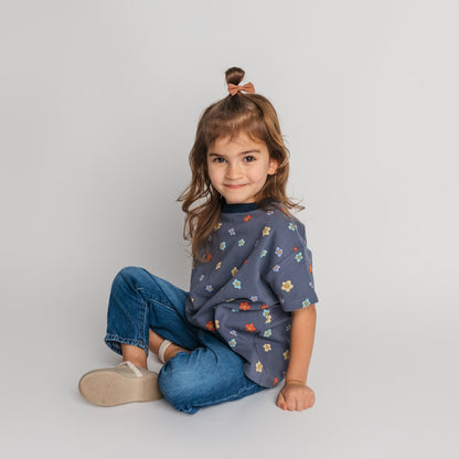 Toddler wearing soft cotton blue daisy t-shirt in relaxed oversized fit - comfortable quality children's clothing