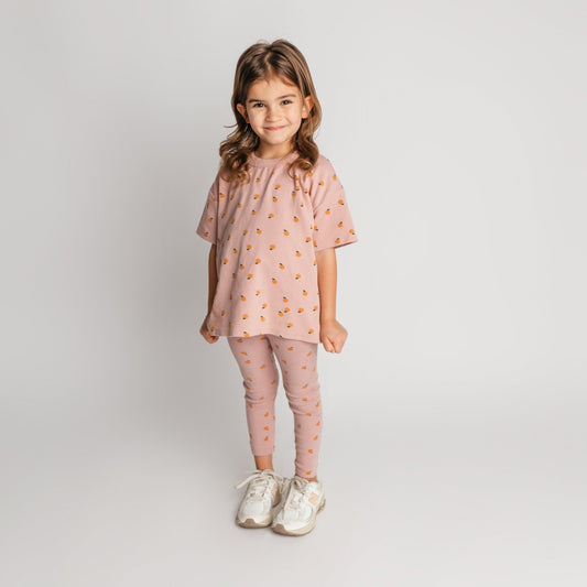 Child wearing mauve mandarin t-shirt in loose comfortable fit - quality toddler tee