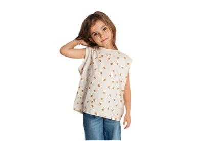 Child wearing ivory mandarin sleeveless tee in relaxed fit - high quality cotton toddler tee
