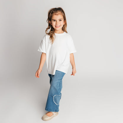 Toddler wearing the original super soft high quality cotton white t-shirt in relaxed oversized fit - comfortable quality children's clothing