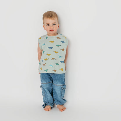 Child wearing mint dino sleeveless shirt in loose comfortable fit - quality toddler tee