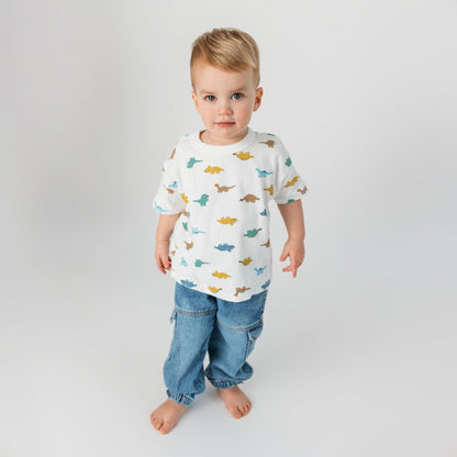 Toddler wearing soft cotton white dino t-shirt in relaxed oversized fit - comfortable quality children's clothing
